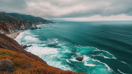 Fototapeta premium Breathtaking coastal scenery along Highway 1 with turquoise waters and dramatic cliffs under a cloudy sky