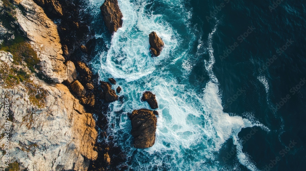 Aufkleber aerial view of turbulent ocean waves crashing against rugged coastal rocks with clear space for text