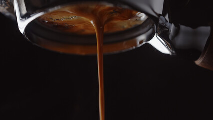 pull espresso shot with bottomless portafilter on a professional coffee machine