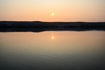 Sunset on the sea. Reflection of the sun on the water.