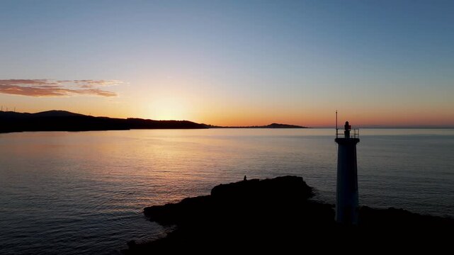 Faro baliza do Lago And Calm Sea At Dusk in A Coru&ntilde;a, Spain. - aerial shot