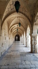 Fototapeta premium A long corridor with stone arches and hanging lanterns, creating an atmosphere of antiquity and mystery. Great for historical and cultural publications.
