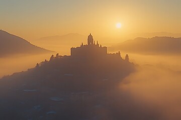 Misty Sunrise Silhouette: Hilltop Cathedral in Golden Light