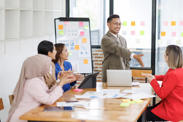 Business asian people, happy and celebration for success in office with company investment and stock market bonus. Teamwork, employees and support or trading achievement excited in boardroom.