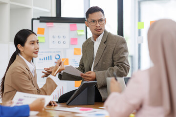 Business asian people, happy and celebration for success in office with company investment and stock market bonus. Teamwork, employees and support or trading achievement excited in boardroom.