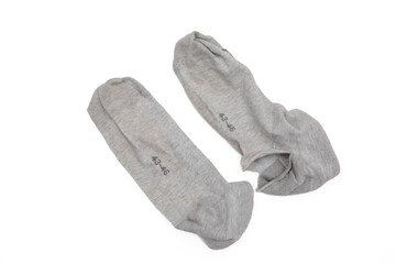 Pair of Grey Socks with a Big Hole in One, Close-Up of Torn Fabric