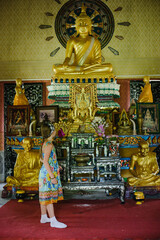 Portrait of a little girl in Asia in Thailand in the temple