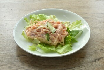 baking spaghetti slice ham pork with mashroom topping fish egg in mayonnaise cream sauce on plate   