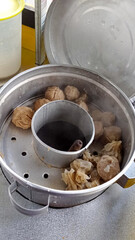 Bakso or beef meatballs in a steamer.