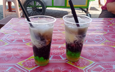 Es teler, a traditional Indonesian dessert, consists of ice, avocado, young coconut, jackfruit,...