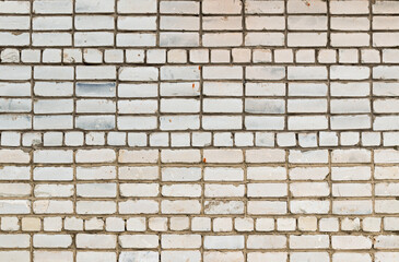 Fototapeta premium the wall of a modern building made of white silicate brick. texture for the background