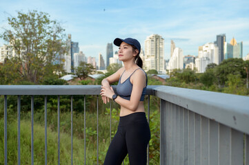 Young Woman Enjoying a Sunny Day While Exercising Outdoors in an Urban Park Setting