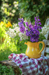 Watering can with flowers