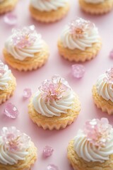 Delicate cupcakes adorned with creamy frosting and pink floral d