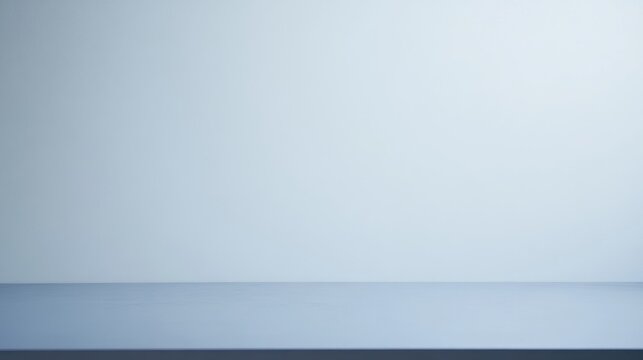 Simple, minimalist studio background with a light blue wall and tabletop.