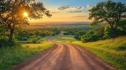 Obraz premium Majestic Sunset over Rolling Hills: A Scenic Country Road Beckons