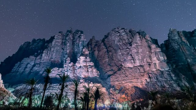 Time lapse of stars motion in Wadi Disah, with beautiful rock and date tree in Tabuk,  Saudi Arabia