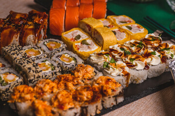A set of sushi and rolls on the festive table