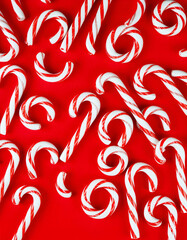 christmas canes on red background