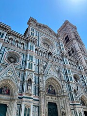 Fototapeta premium Cathedral of Santa Maria del Fiore (aka Florence Cathedral, Florence Duomo, Duomo di Firenze). This neo-gothic facade is done in white, green and red marble. July 19, 2024
