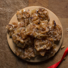Overhead view of nigerian coconut candy, top view of candied coconuts discs, flatlay of bukayo candy or coconut drops