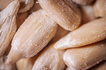 Close-up view of shelled sunflower seeds showcasing their natural beige color and textured surface, perfect for health-focused and nutritional themes.
