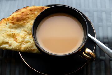 Chai tea with Roghni Naan soft, fluffy and nostalgic of the fresh naans in Pakistan.