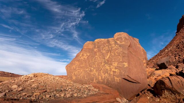Time lapse of cloud over Inscription on the rock by Nabatean in Tabuk, Alula, Saudi Arabia