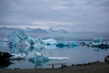 Icebergs and seal in Jokulsarlon lagoon water in iceland near the diamond beach at sunrise