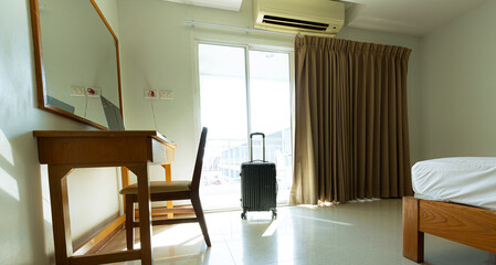 Luggage in hotel room,Plastic hard shell luggage with extended telescopic handle,Inter views of modern hotel room