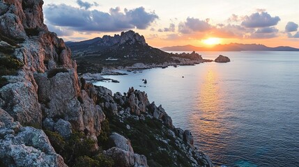 Fototapeta premium Serene Sunset Over the Mediterranean: A breathtaking view of the Mediterranean Sea at sunset, with rocky cliffs, lush vegetation, and a tranquil atmosphere.