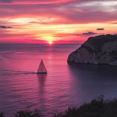 Selbstklebende Fototapeten A solitary sailboat glides through the tranquil waters as a breathtaking sunset paints the sky in vibrant hues of pink and orange. © Andrew