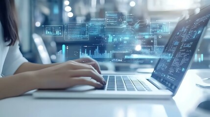 A clean and bright setup with a laptop on a white desk and fingers actively typing, representing digital work