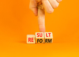 Reform and result symbol. Concept words Reform Result on beautiful wooden block. Beautiful orange...