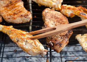 Juicy meat cooked on the grill over an open fire