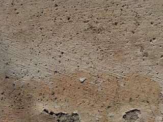 Cracked concrete wall covered with gray cement surface as background, abstract, grunge