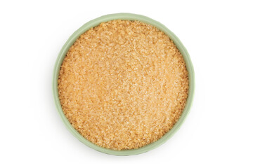 The brown sugar in ceramic bowl isolated on white background. Top view. Flat lay