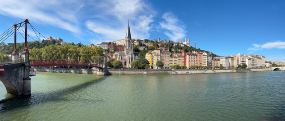 Obraz premium St George Church of Lyon, pedestrian passerelle over the river Saone, Lyon, France.