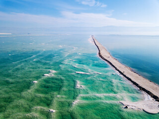 Dead sea salt shore. The path from the evaporated salt. Israel. Shooting from the drone.