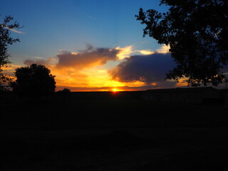 Reddish summer sunset over a lake in northern Spain