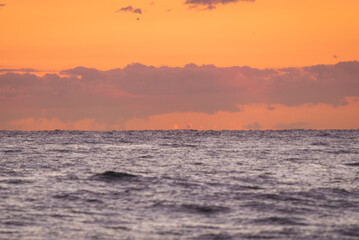 A beautiful sunrise over the sea. The morning sun illuminates the sea. Dawn in the Mediterranean Sea. Sun reflections in the water sunset on the beach