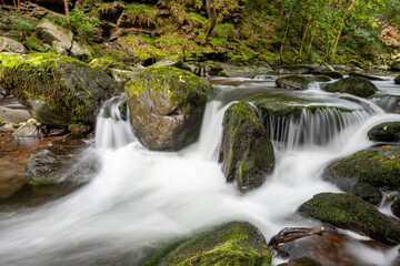 Long exposure of a waterfall on the East Lyn river at Watersmeet in Exmoor National Park