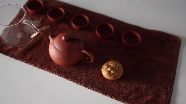 tea ceremony made of yasin clay and a figurine on the table