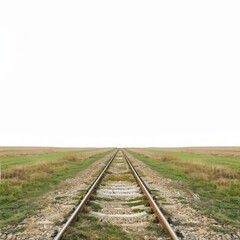 Obraz premium Railroad tracks stretching across a grassy field disappearing into a vast white background on a cloudy day, creating a sense of endless possibility and adventure
