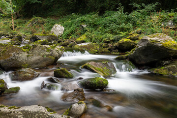 Long exposure of a waterfall on the East Lyn river at Watersmeet in Exmoor National Park