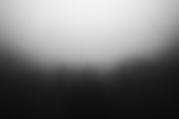 Obraz premium A soft gradient gray background transitioning delicately between light and dark tones, creating a modern and sleek feel