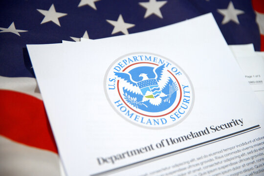 5.1.2025, United States. Security Report paper on a USA flag in the backdrop. U.S. department of homeland security concept background