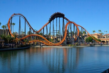 Exciting roller coasters with vibrant tracks and cheerful riders under a bright sky. Amusement Park. AI generated image
