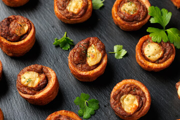 Mini Yorkshire puddings with shredded beef and gravy