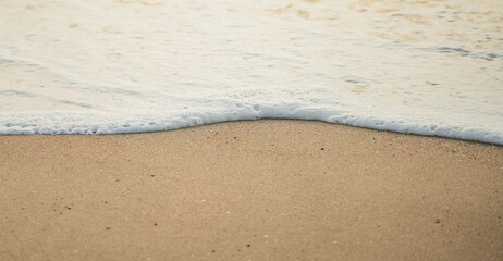 sand and waves on sea for abstract background.